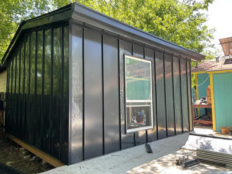 Black standing seam metal wall panels for Roof Inspection in Tichigan